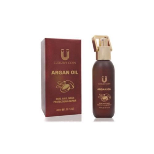 قیمت و خرید روغن آرگان لاکچری کوین کنار هستههای آرگان و شاخه درخت آرگان